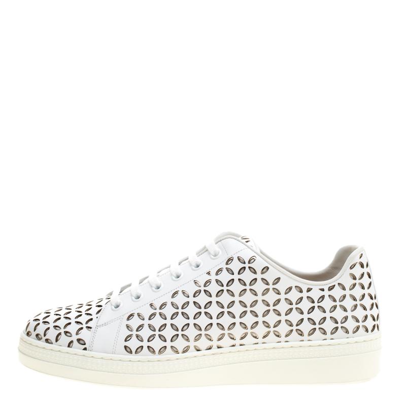 Fashioned to take your style a notch higher, these sneakers from Alaia are absolutely worth the dream and the splurge! They've been crafted from leather and styled with laces on the vamps and laser cuts all over.

Includes: Original Box



