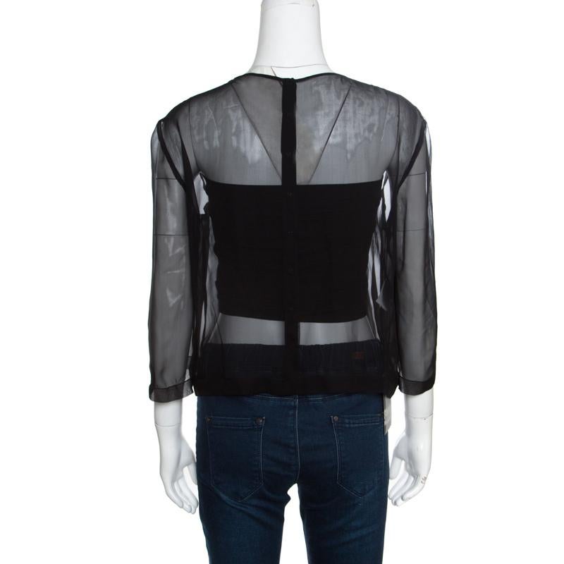 Include this stylish blouse from Alberta Ferretti in your closet to introduce a chic piece into your party closet. Crafted with a panel detail on the front, this lovely blouse carries a classic black hue and features sheer silk lace, long sleeves