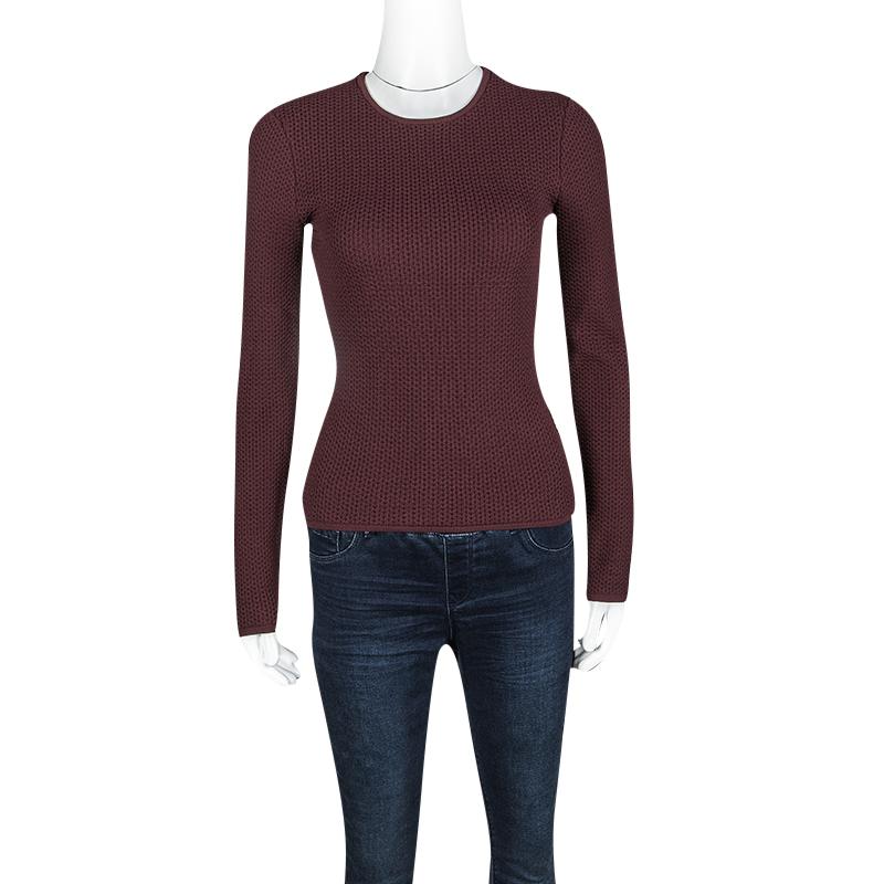 Alexander wang's sweater is crafted in a fitted silhouette in a gorgeous burgundy hue. Featuring a nylon body, this sweater comes with full sleeves and a rounded neckline. Style with everything from flared trousers to regular denim for a chic look