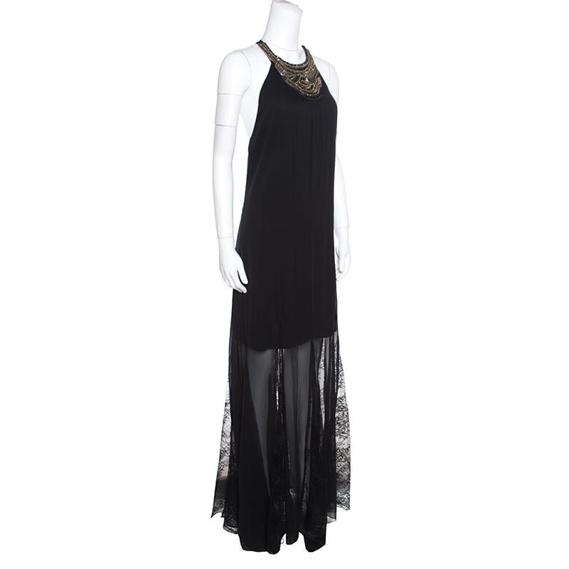 This gorgeous Alice + Olivia dress promises you a look nothing less than a diva! Stunning in its details, this black creation is made of a blend of fabrics and features an artistic silhouette. It flaunts a crew neck that is beautifully detailed with
