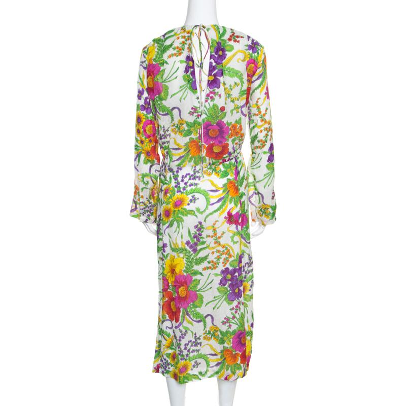 Flouncing with breathtaking charm, this Balenciaga dress is what you need to grab all the stares and compliments on your next outing. This multicoloured outfit is rendered in crinkled silk and features lovely floral print all over that make the