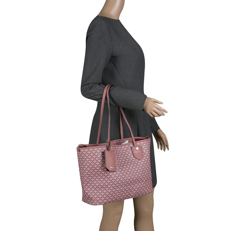 This posh, coated canvas tote that exudes class and style, is brilliantly made and is high on functionality. It is from Bally and it features two shoulder handles and a canvas interior that can accommodate all your essentials.

Includes: Original
