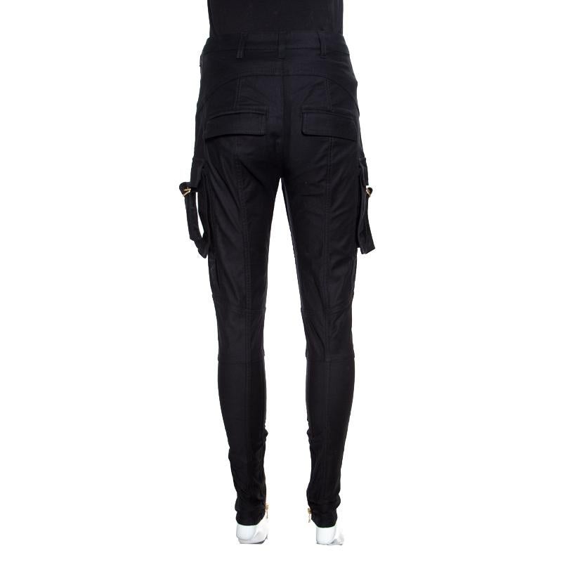 Balmain brings you this pair of pants that are high in style and comfort. It is made of quality fabrics and designed in a high waist style with front fastening and flap pockets on the sides. It will look just right with a fashionable top and high