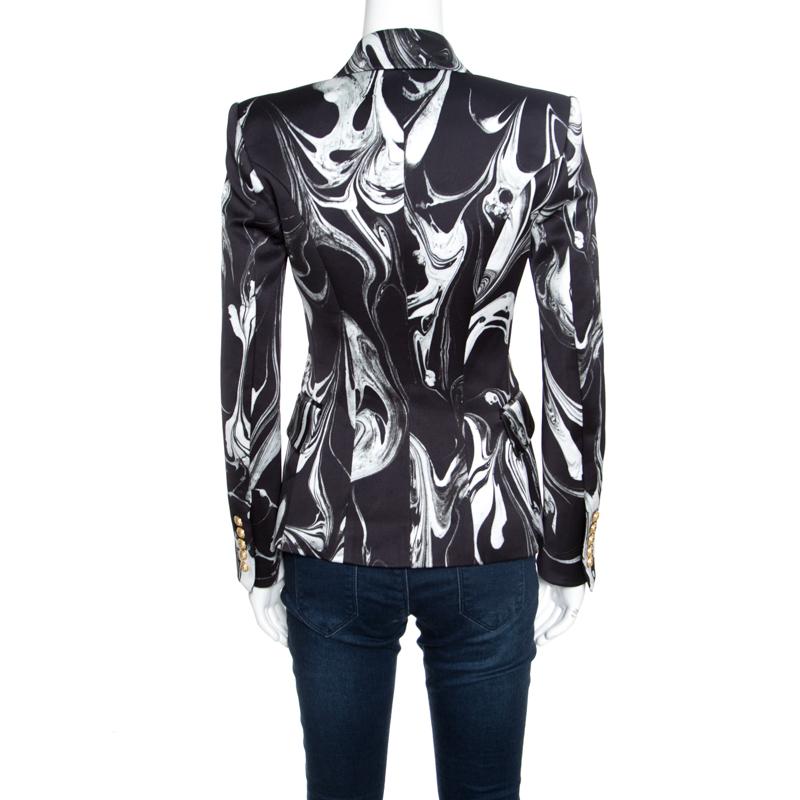 All of Balmain's designs have an edge that resonates with the fashion tastes of the modern world. This blazer is equally stunning with its marble prints, long sleeves, and the double-breasted design. You can rock this blazer with pants and a pair of