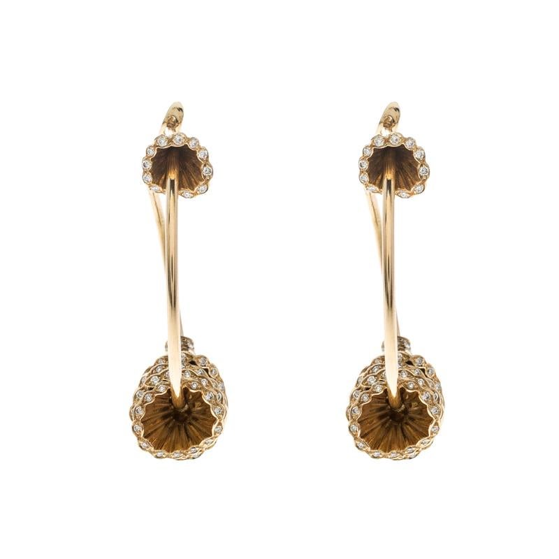 It is definitely Love At First Sight with this pair of Boucheron earrings from their Frou Frou collection. Beautifully crafted from 18k yellow gold as hoops, they are detailed with pleated cups, a design achieved through careful attention and skill.
