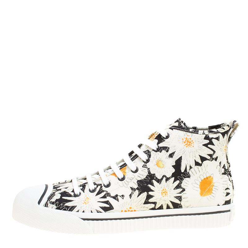 Fashioned to take your style a notch higher, these high top sneakers from Burberry are absolutely worth the dream and the splurge! They've been crafted from canvas and styled with laces on the vamps and floral prints bursting all over.

Includes:
