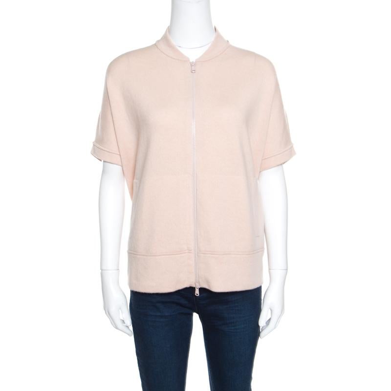 Brunello Cucinelli brings to you this fabulous sweater that is sure to fetch you compliments from one and all. The blush pink creation is made of 100% cashmere and features a well-defined silhouette. It flaunts a close-cut neckline, a front zip