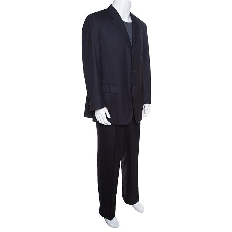 Walk into any formal gathering with style in this Herringbone suit from Brioni. It comes tailored from quality wool in a charcoal grey shade. The blazer comes with three front buttons and pockets, while the pants come with folded