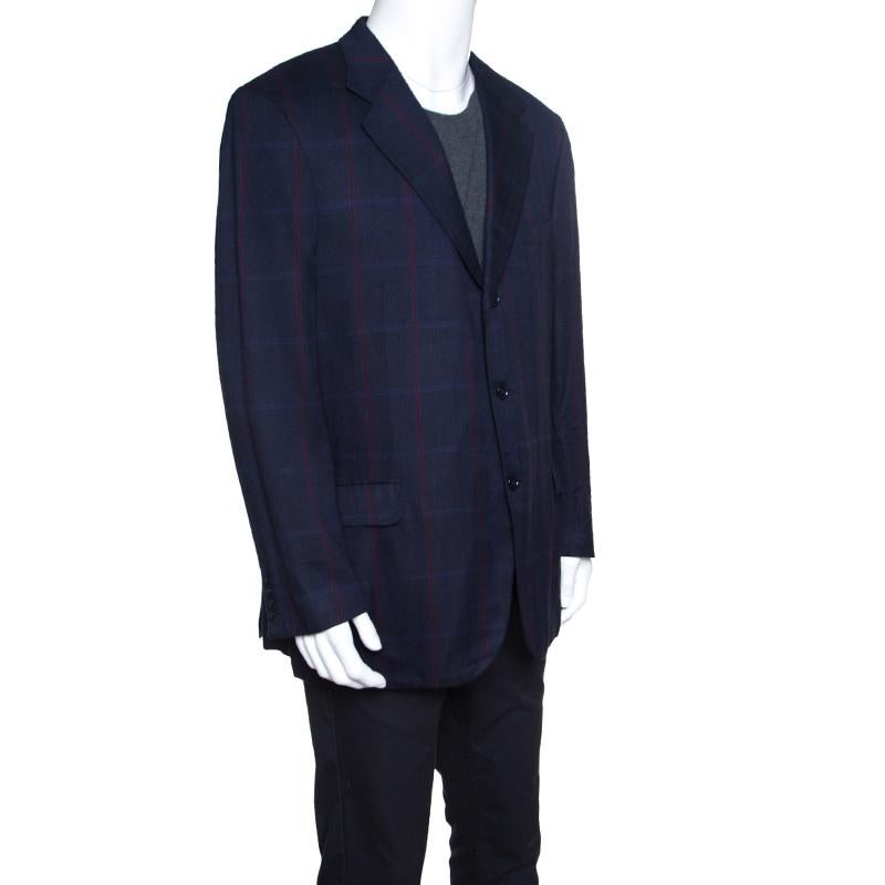 When you come across something as luxurious and refined as this Palatino blazer from Brioni, you are sure to grab it and make it one of your most prized possessions! This navy blue blazer is made of 100% rayon in a check pattern design and features