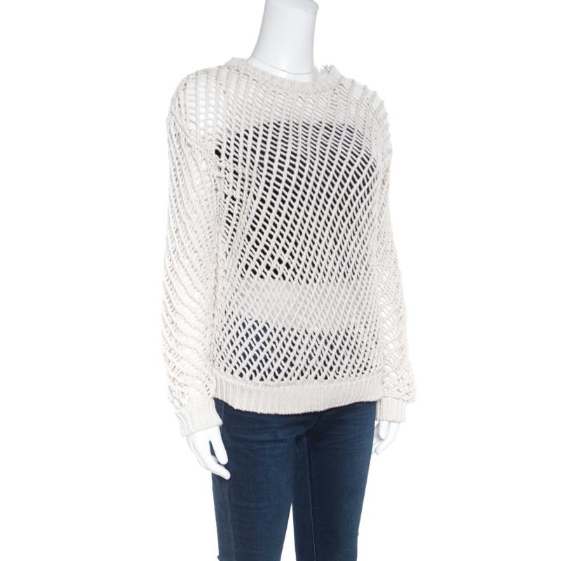 Brunello Cucinelli brings to you this fabulous sweater that is sure to fetch you compliments from one and all. The cream creation is made of a cotton blend and features an open knit design. It flaunts a round neckline and long sleeves. Pair it with