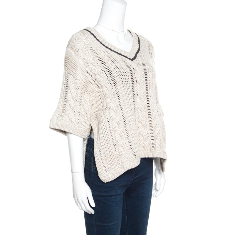 Brunello Cucinelli brings to you this fabulous sweater that is sure to fetch you compliments from one and all. The beige creation is made of a cotton and wool blend and features a knit design. It flaunts a V-neckline with a contrasting trim