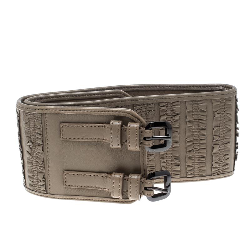Add more style to your wardrobe with this wide belt from Burberry. Crafted from beige leather, this accessory features a vertical ruffle design and a double buckle fastening. Cinch it over your flowy dresses for a statement look.

Includes: The