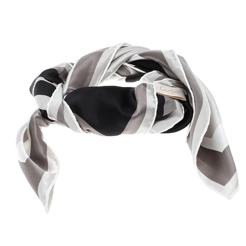 Coming from the house of Cartier, this scarf is a versatile accessory to own. It features a monochrome logo print all over and features a soft and luxurious silk body. It is finished with rolled edges and lends an interesting feel to any outfit you
