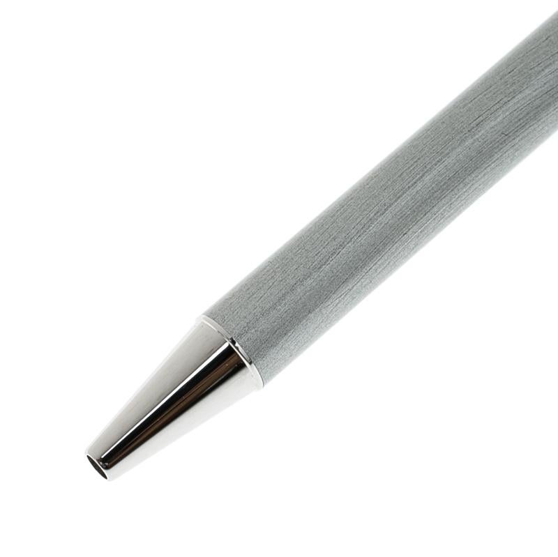 Cartier brings you this lovely ballpoint pen that has been made from silver lacquer and enhanced with palladium-plated fittings. It has been styled with the plain elegant design which is unique to the brand. The pen is easy to use with its push