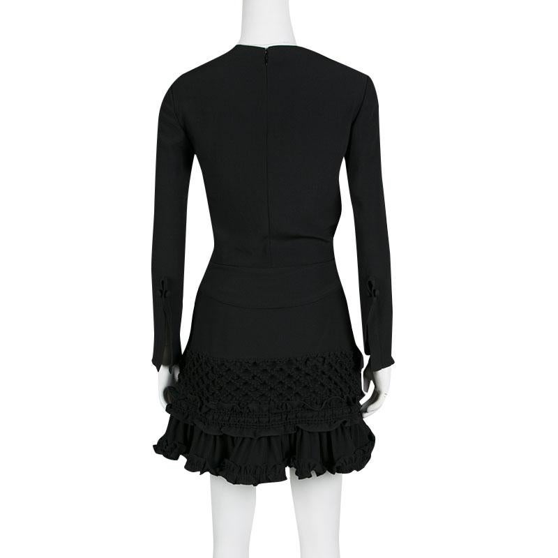 black dress with ruffles at the bottom