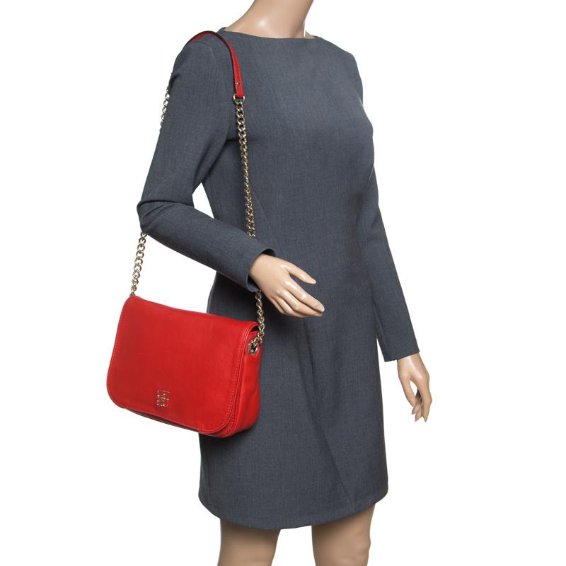 Now here's a bag that is both stylish and functional! Carolina Herrera brings us this gorgeous New Baltazar shoulder bag that has been crafted from red leather and designed with a flap that opens up to a fabric interior capable of carrying all your