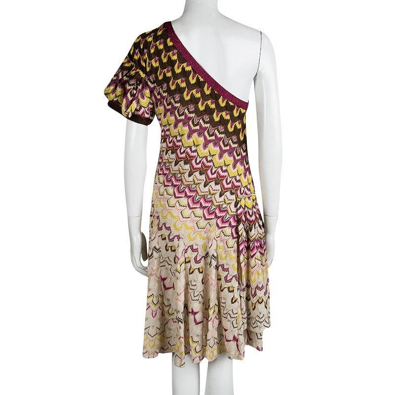 Update your wardrobe with a signature Missoni knit multicolour dress by M Missoni. Woven with metallic yarn for an all-over shimmer, the flared design is cut with a one-shoulder detail and a ruffled sleeve. A drop waist creates a cinched-in
