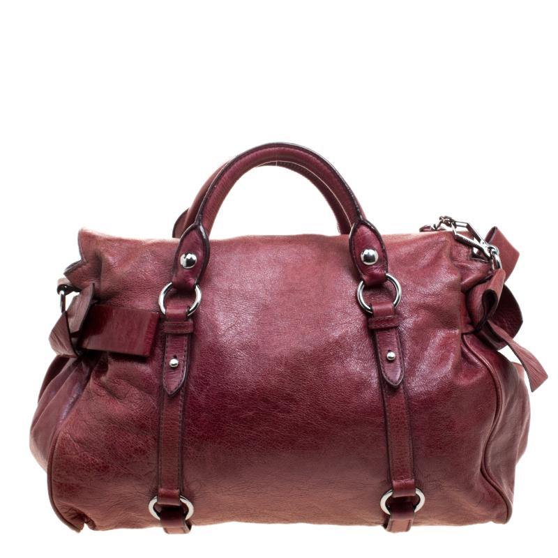 A tote is a woman's best friend. Your whole world can fit into it and still have space leftover for a friend in need. This leather handbag from Miu Miu is a classic with its spacious interiors and silver detailing. The bag also has a strap so it can