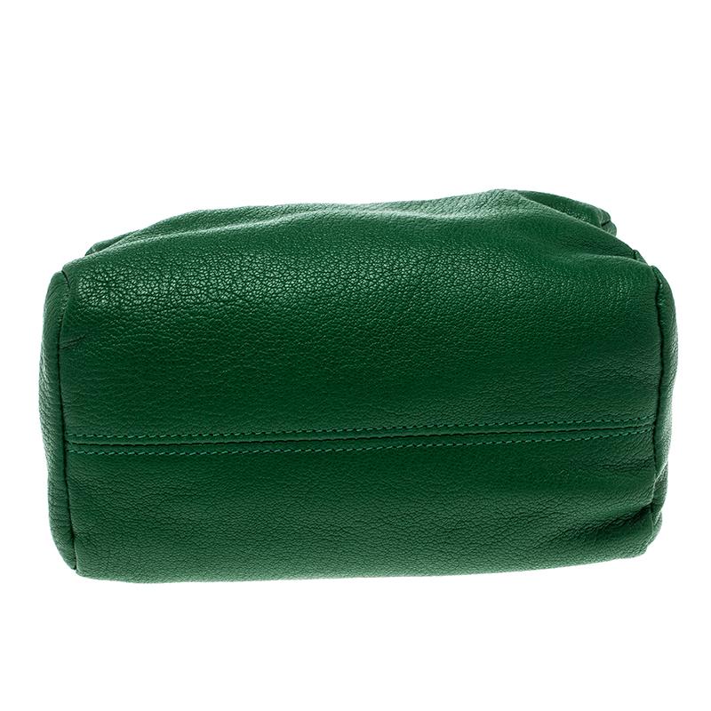 Keep your basic things handy without compromising on style with this Pandora Clutch. Being Givenchy’s creation, this accessory is remarkably designed from bright green grained leather to complement any hued outfit. It has one main compartment with