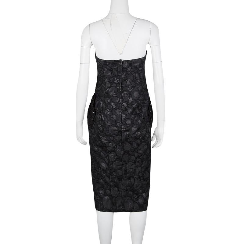 Marc Jacobs takes the classic retro beauty of the polka dot and combines it with the gorgeous detailing of the lace in this gorgeous strapless gown. This gown, with its incredible fit and the added pocket details, is a sure eye catcher in any event