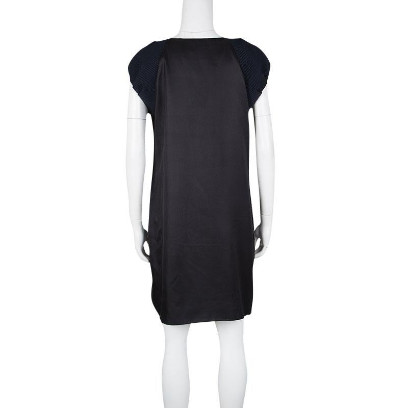 Your choice of this dress from Zac Posen will be perfect for a cool night party due to its complete wool makeup. It is textured to give a gorgeous look especially when it is coupled with the pleat cap sleeves. The front of this simple one-piece is