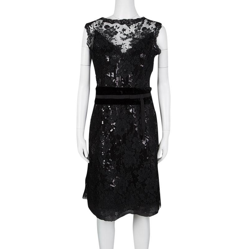 A gorgeous party outfit that creates the perfect balance with your favourite colour and your love for a little glitz. This dress by Dolce and Gabbana is crafted out of a luxurious silk blend with intricate lace detailing and sequins all over the
