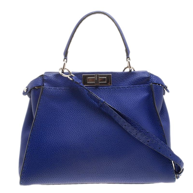 This heavenly Peekaboo from Fendi is highly coveted, and since its birth in 2009, it has swayed us with its shape, design, and beauty. This blue version is a joy to witness! It comes meticulously crafted from leather and designed with a top handle