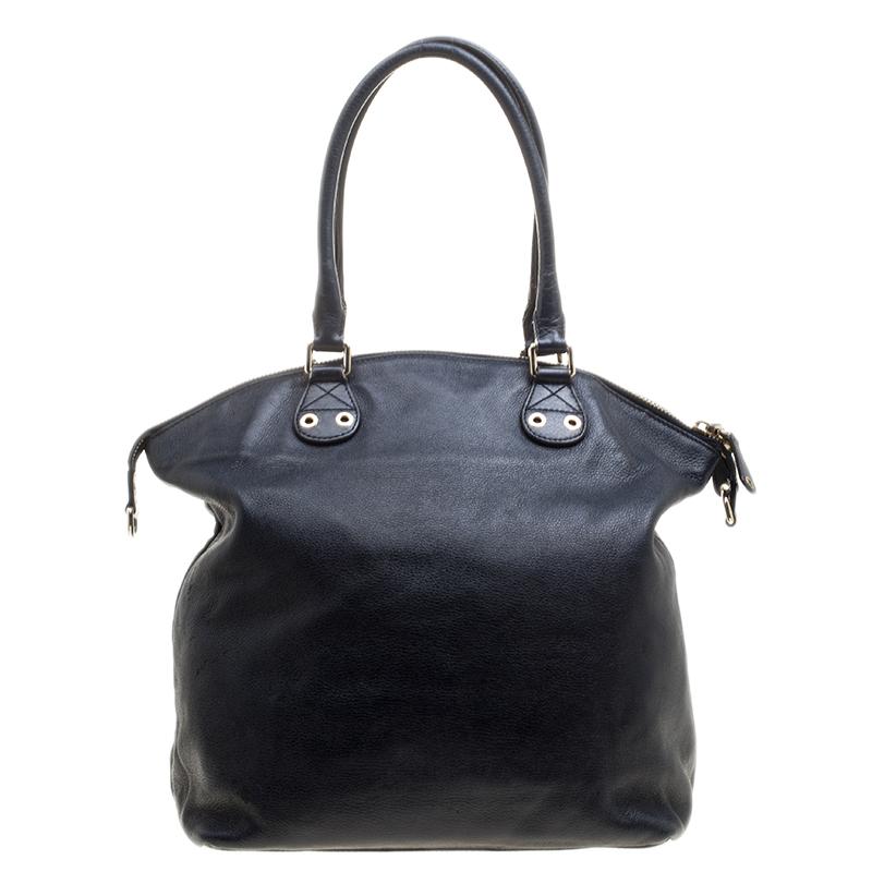 Invest in this Gucci leather bag that can hold more than just your essentials. The navy blue color with fabric lined interior makes this one a delightful accessory to own. Cool yet classy, this is a must-have for this season.

Includes: The Luxury