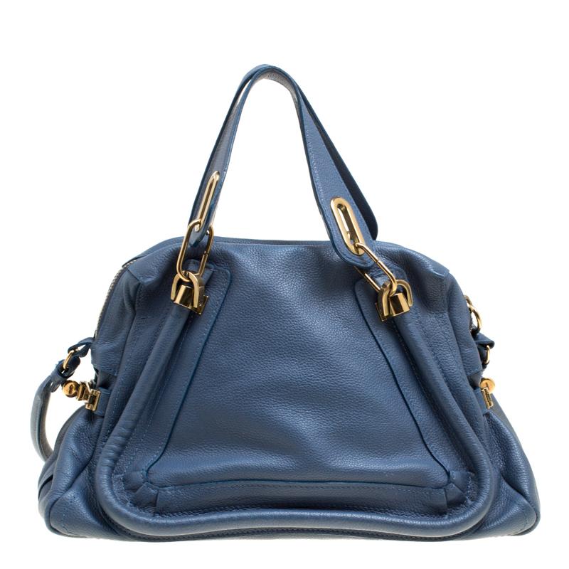 Stunning in a lovely blue shade, this Paraty bag from Chloe is crafted from leather and shaped into a lovely silhouette. The top zipper opens to a spacious fabric interior and the bag is complete with two handles and a shoulder strap. Own this bag