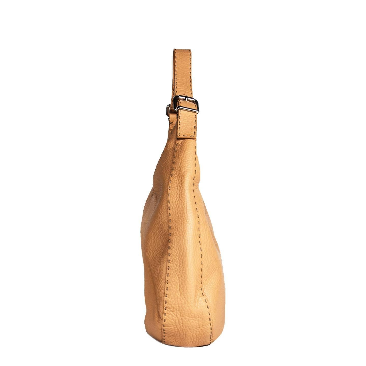 Cuoio Romano hand made hobo bag with contrasting dark color long hand top stitches on all seams and silver chunky zipper and buckles. Beautiful roman leather made with totally ecological leather containing no substances that may be harmful to man
