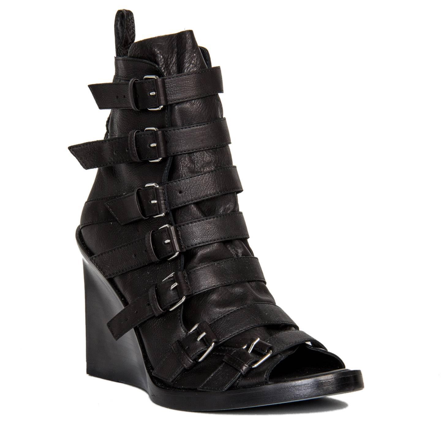Black leather bondage buckles ankle boots with open front and stacked wedge and sole. Vero Cuoio. Made in Italy. Heel 4