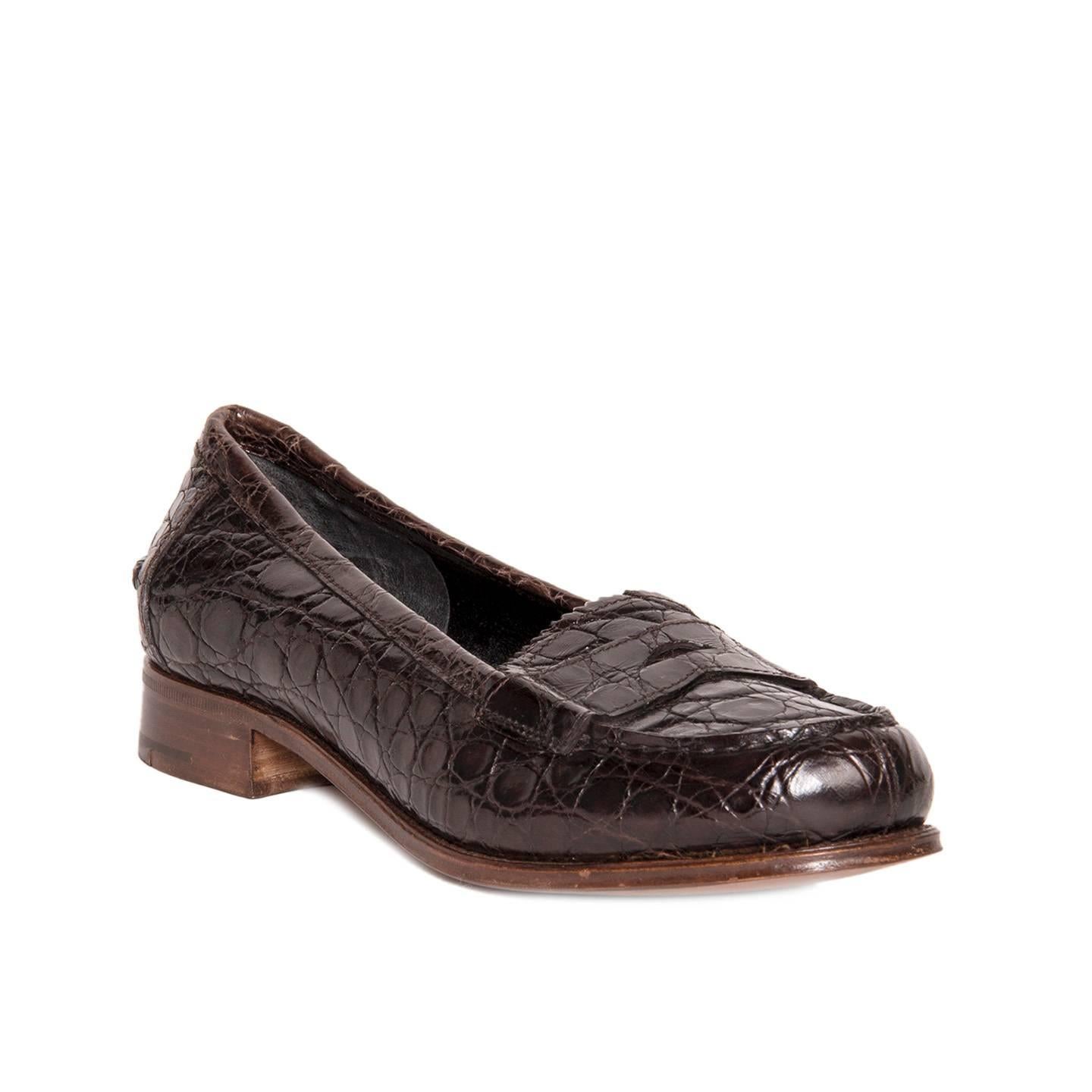 Brown crocodile penny loafers with wooden heel. Vero cuoio. Made in Italy.
Heel 1