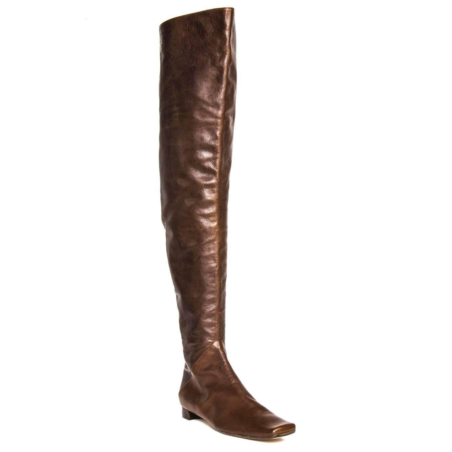 Brown leather thigh high boots with square toe. The instep zipper from heel to mid calf is covered with leather flaps. Vero cuoio. Made in Italy. Heel 1.5