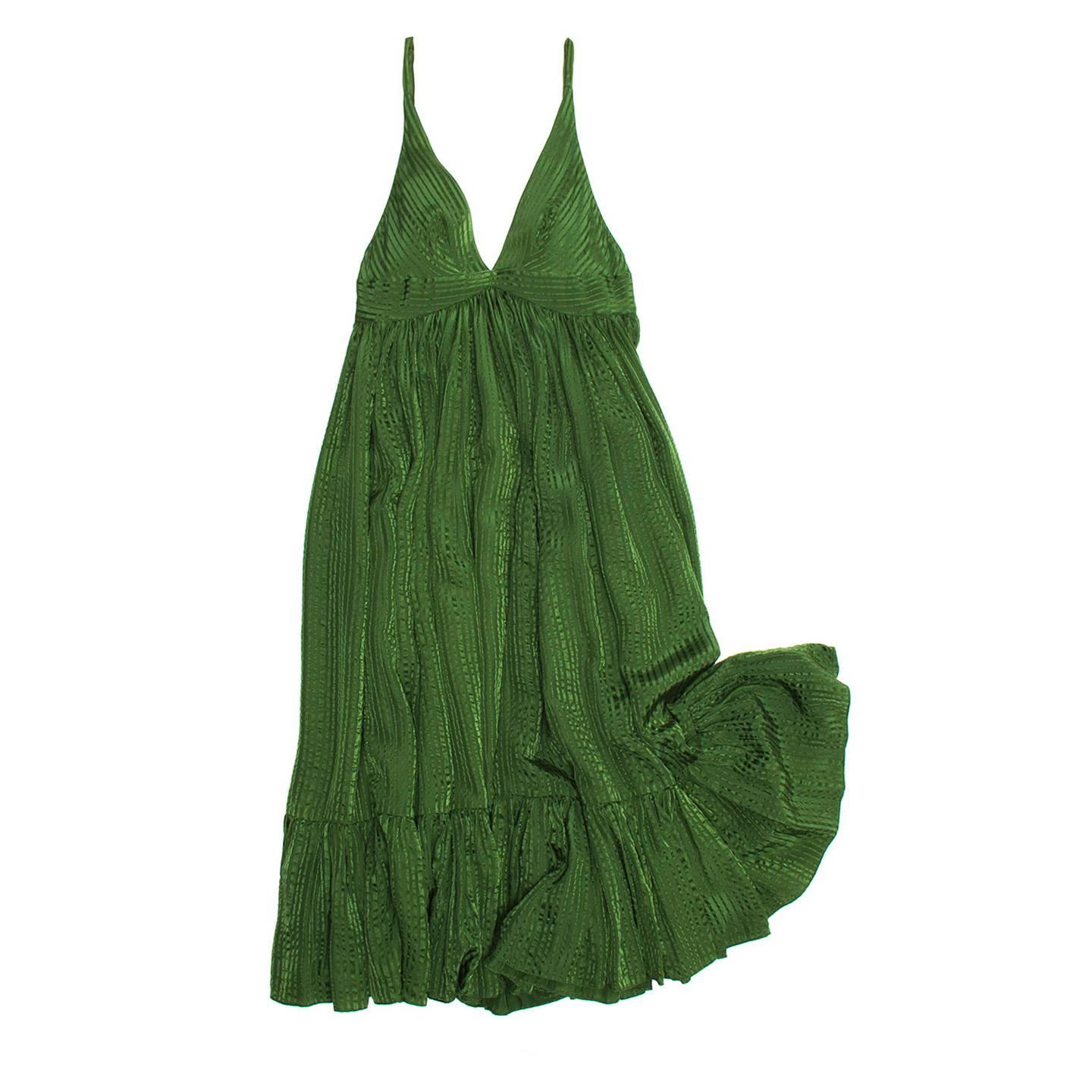Green silk jacquard stripe hippie chic dress with thin shoulder straps and empire line. The body panel is gathered below the empire line around the body creating the volume on the skirt. The dress fit is wide, mid calf length and with a gathered