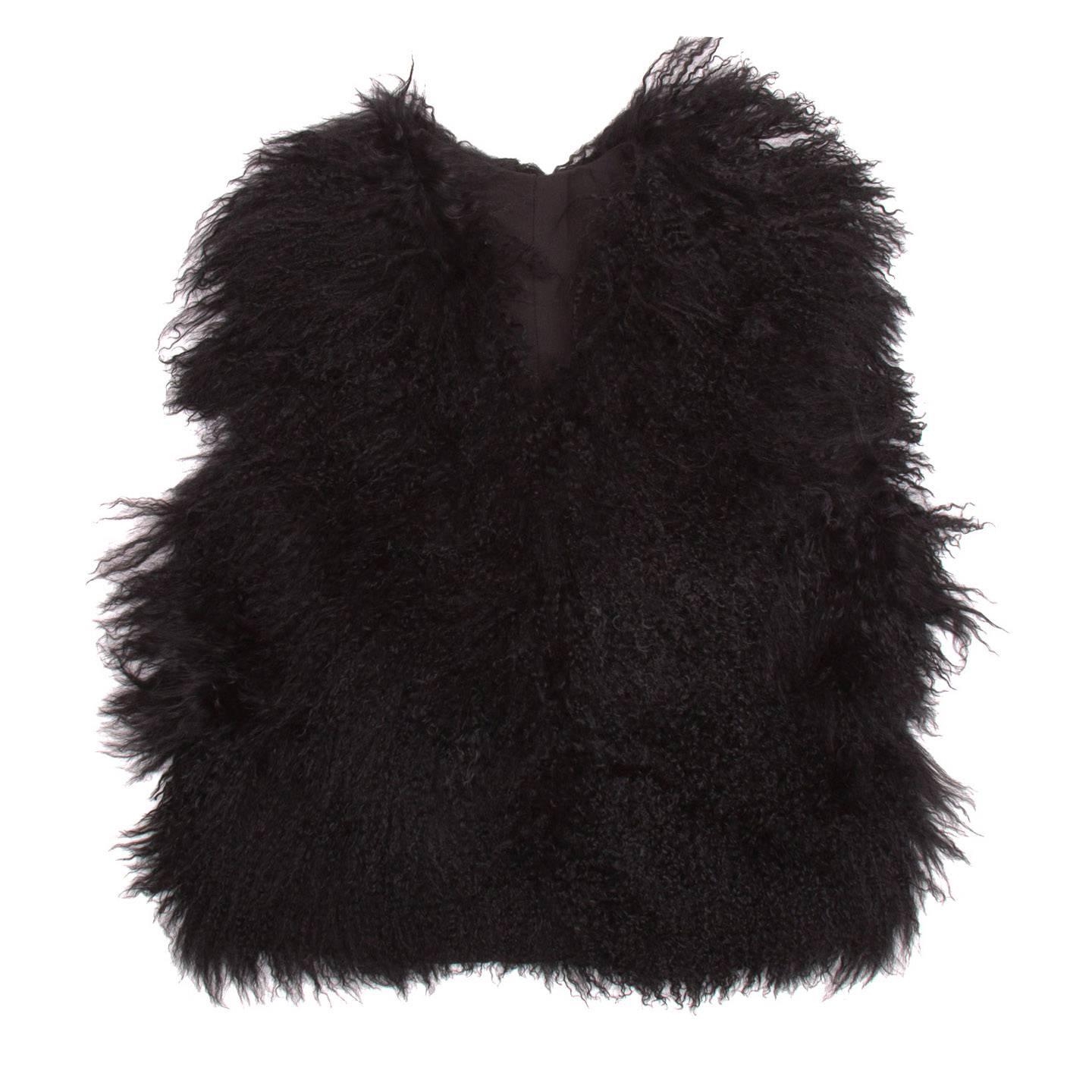 Black waist length Mongolian fur gilet with hook and eye fastening. Purchased in London at Browns.

Size  L Universal sizing

Condition  Excellent: never worn