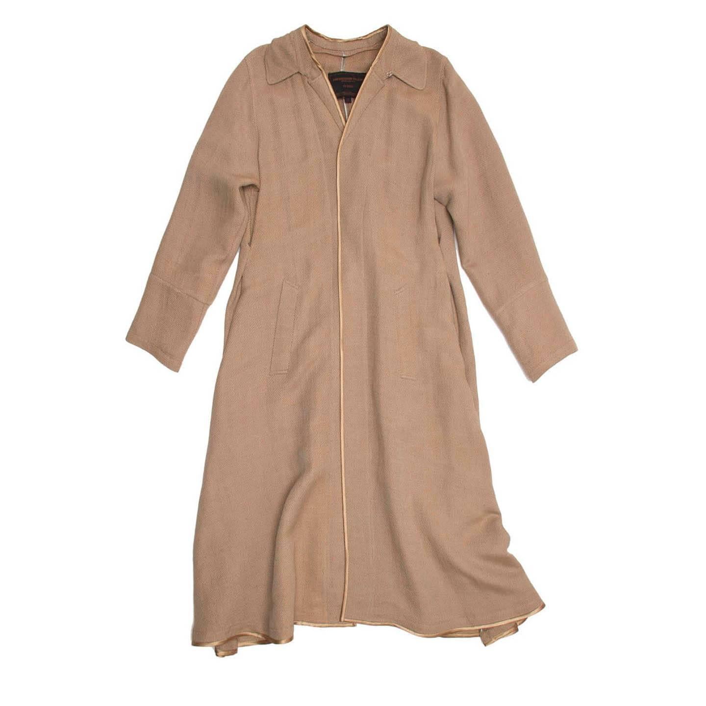 Bronze and beige linen/rayon/cotton blend woven duster style coat with bronze satin binding to cover and embellish front, neckline and hem edges. This piece is characterized by many beautiful and unique details: the collar is folded, stitched down
