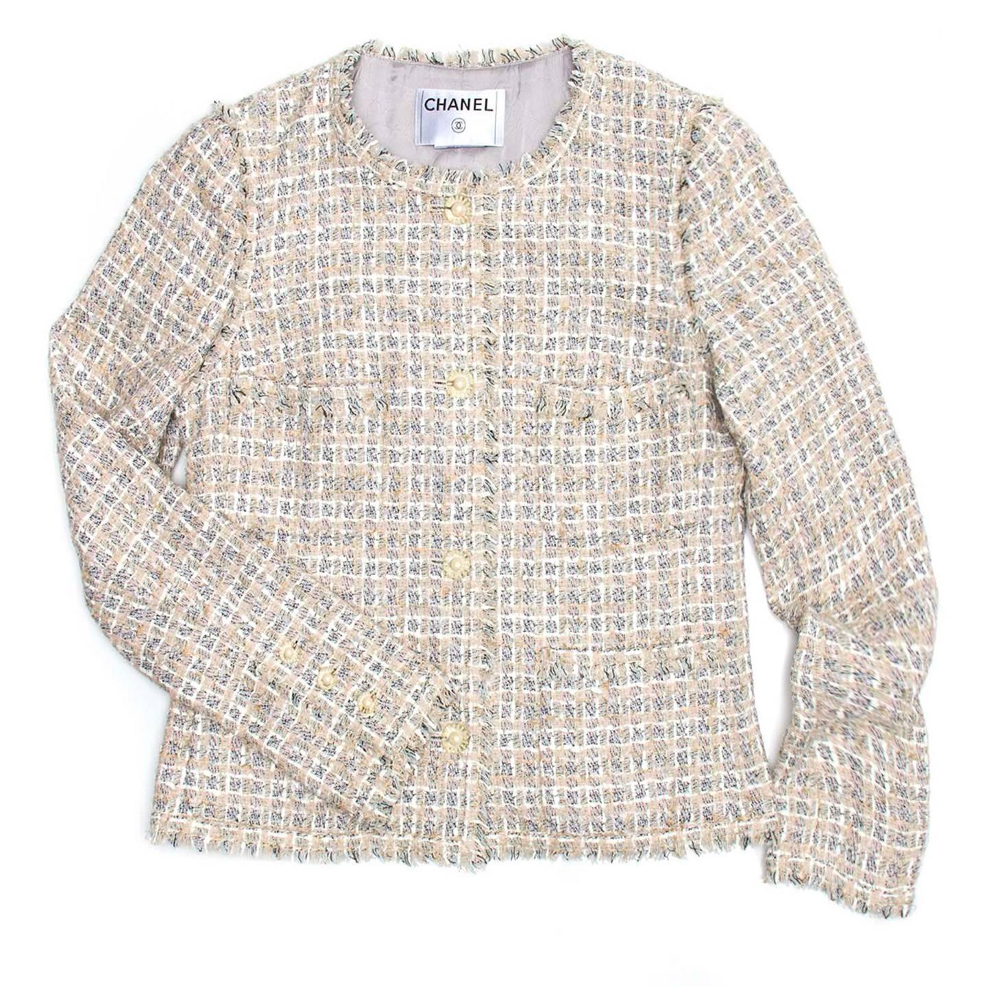 04P Collection: Signature tweed pale pink, blue, & white plaid jacket with plexi buttons with CC Logo.

Size 40 French sizing

Condition Pristine and Excellent