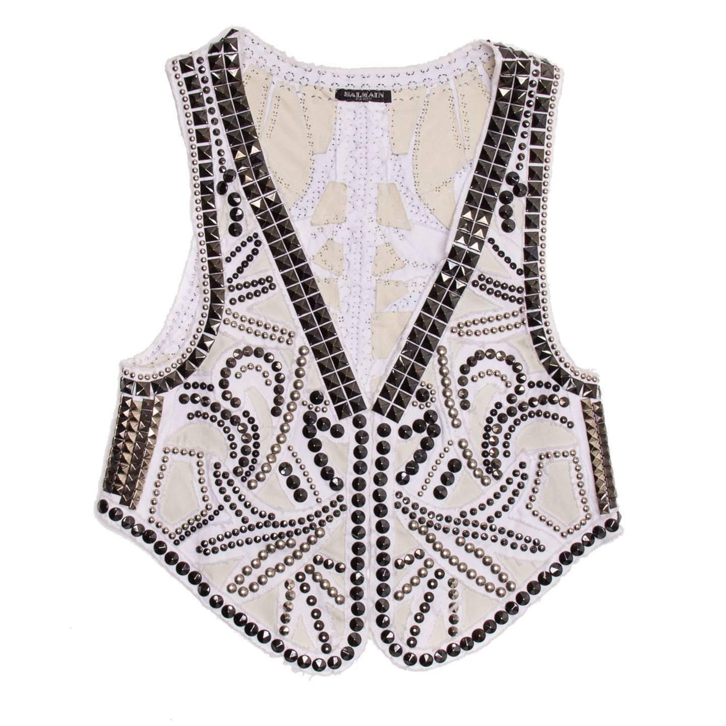 White denim vest with all over silver and gun metal studded design.

Size  38 French sizing

Condition  Excellent: worn a few times