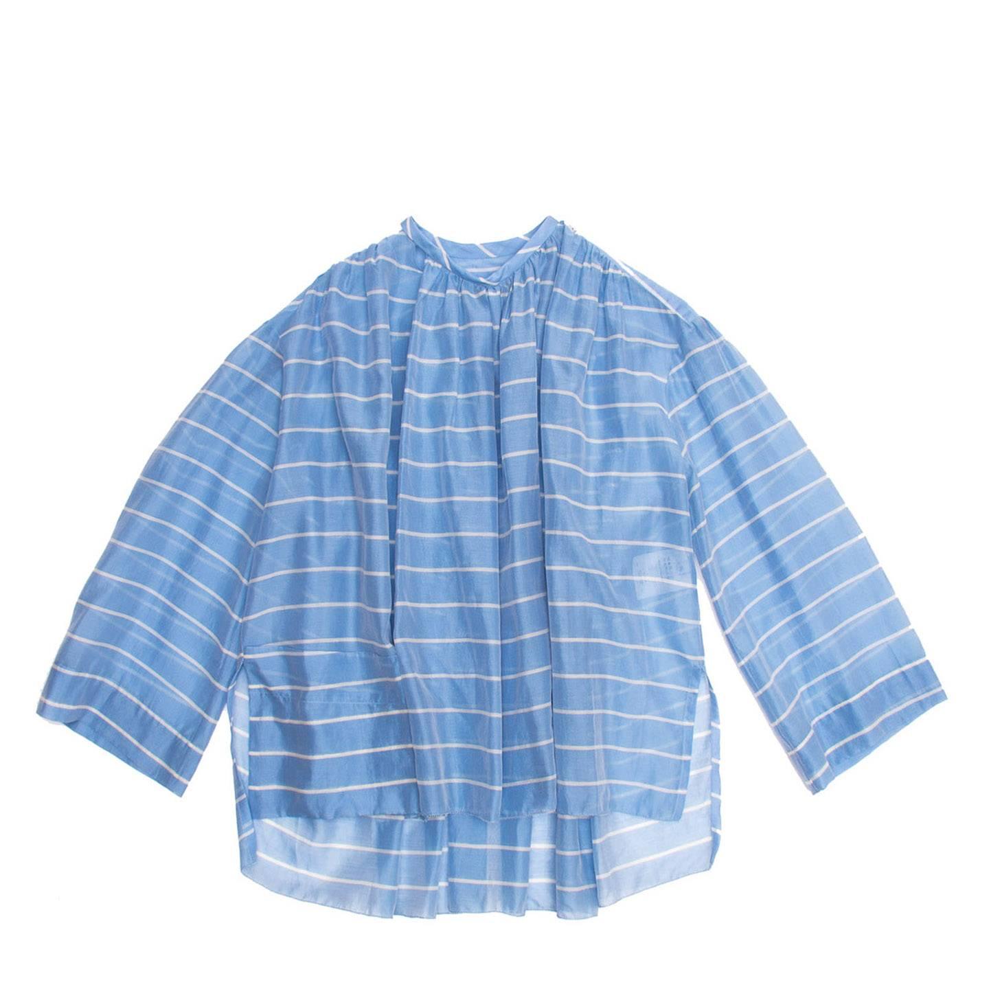 Cotton/silk sheer sky blue and white striped cropped tunic top with round neck and 3/4 sleeves. The front panel is gathered around the front collar and shoulder, the back is gathered on the yoke creating a wider volume at hem. The sleeves are