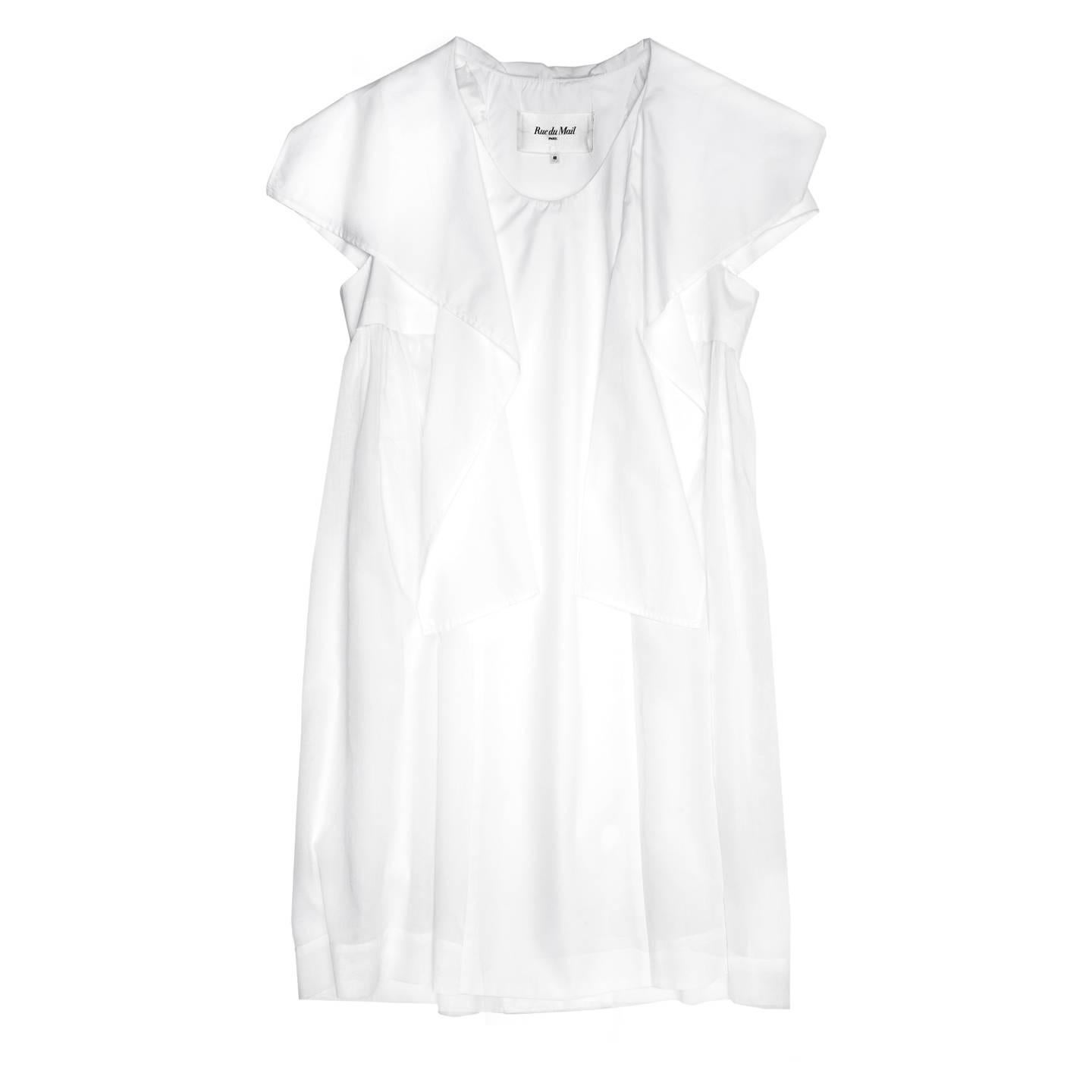 White cotton dress with scooped collar, short sleeves and waterfall drape detail at front neck and bust. The dress length is below knee, fully lined, it has an A-line volume thanks to the thin cotton inserts on the sides that gather at under bust,