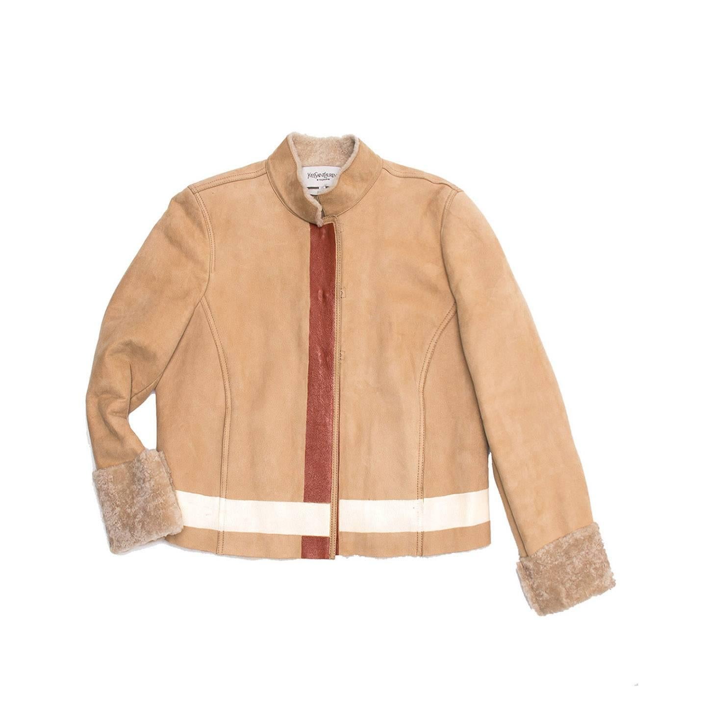 Tan suede shearling lined racer style jacket with hand painted orange/ivory striped detailing on cuff, waist and front closing. Jacket closure is with hook and eye detailing. 

Size  40 French sizing

Condition  Excellent: worn a couple of times