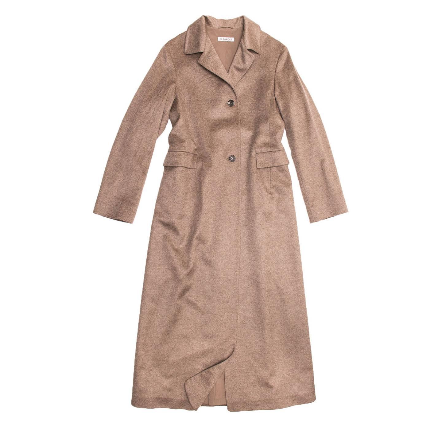 Camel color, cashmere and mink hair floor length coat. Convertible collar which can be worn open or closed, on a single breasted closure with three dark brown buttons. Two front pockets with squared flaps. Adjustable belt visible only at