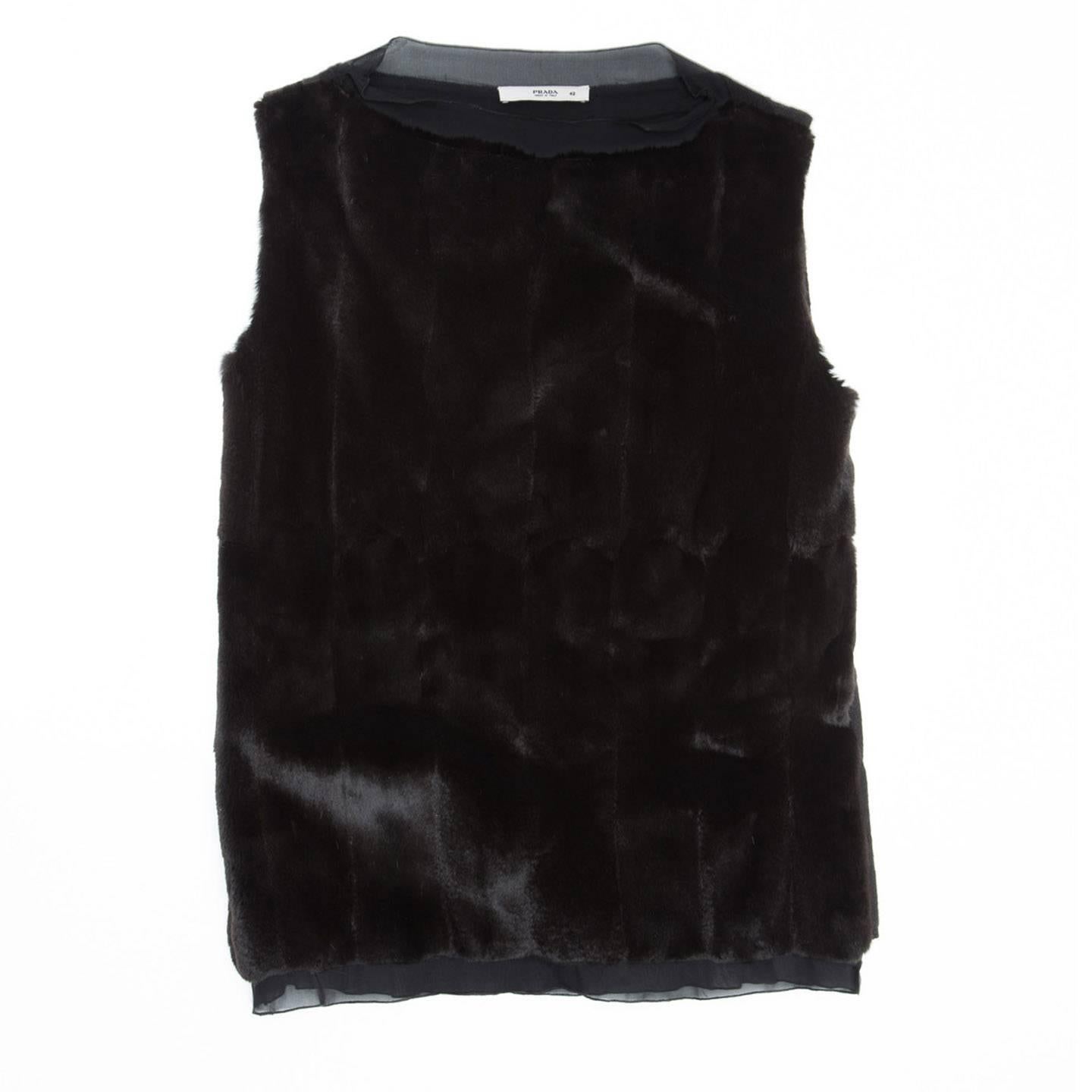 Black top with weasel fur front panel, cashmere back with a vertical design and stretch silk chiffon inserts at neck and hem. Made in Italy.

Size  42 Italian sizing

Condition  Excellent: worn once