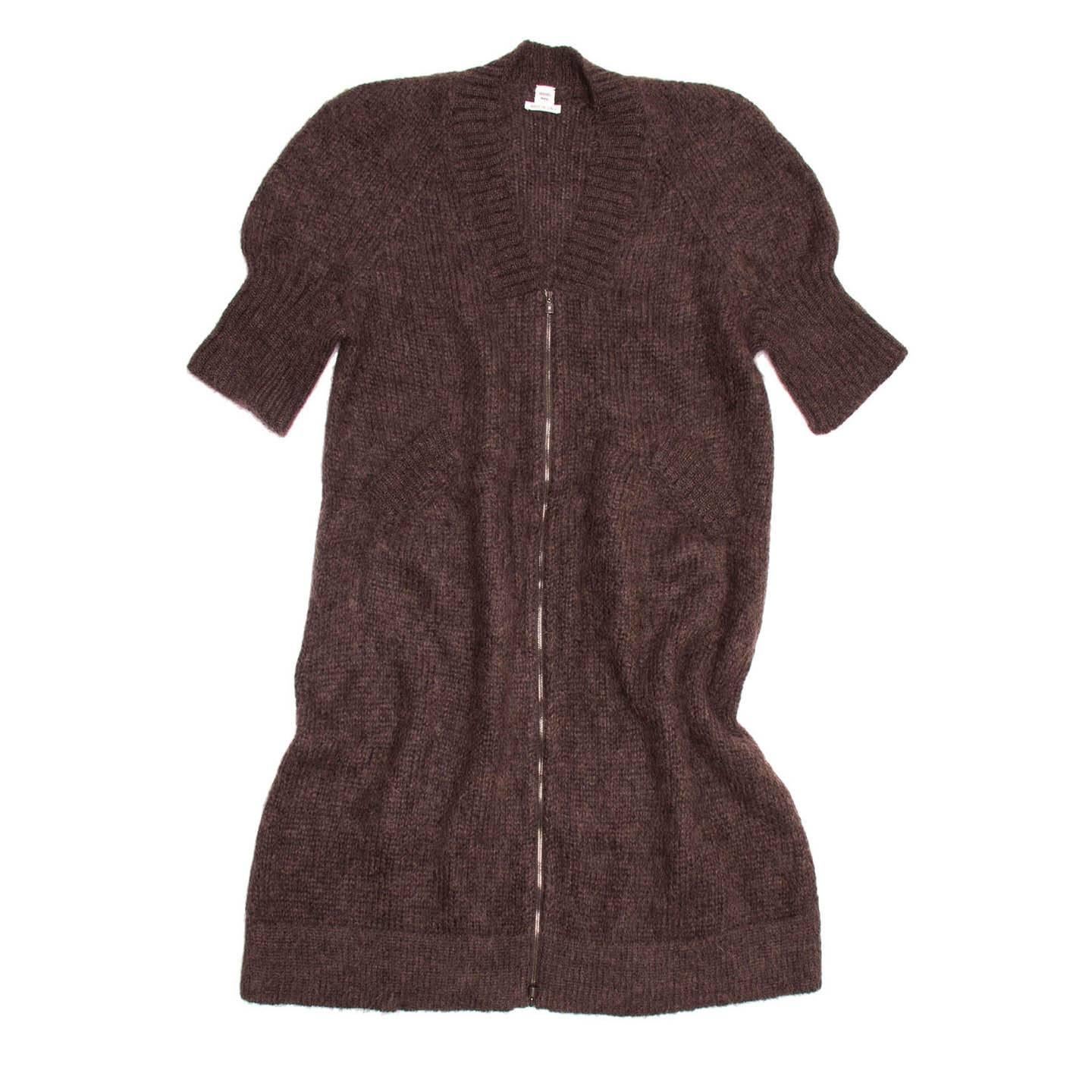 Chocolate brown warm angora knit long top/dress with short cuffed sleeves. The close V-neck is ribbed and elegant to match the little slash pockets at waist and the cuffs. An open-ended visible charcoal grey metallic zipper fastens the