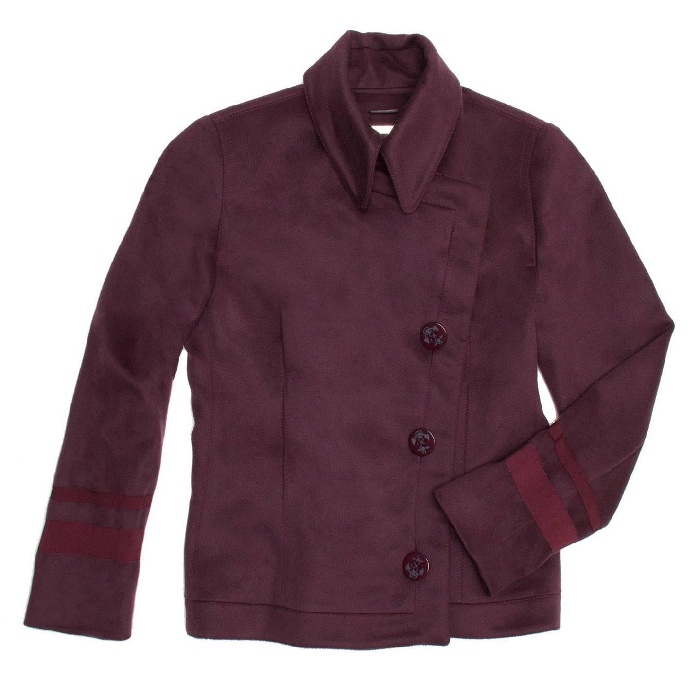 Burgundy cashmere cropped peacoat that tapers at the bottom for a nice feminine fit. Asymmetrical front closure with Anchor 4-holed buttons. Naval stripe detailing on sleeves. Back tail vent.

Size  44 Italian sizing

Condition  Excellent: worn