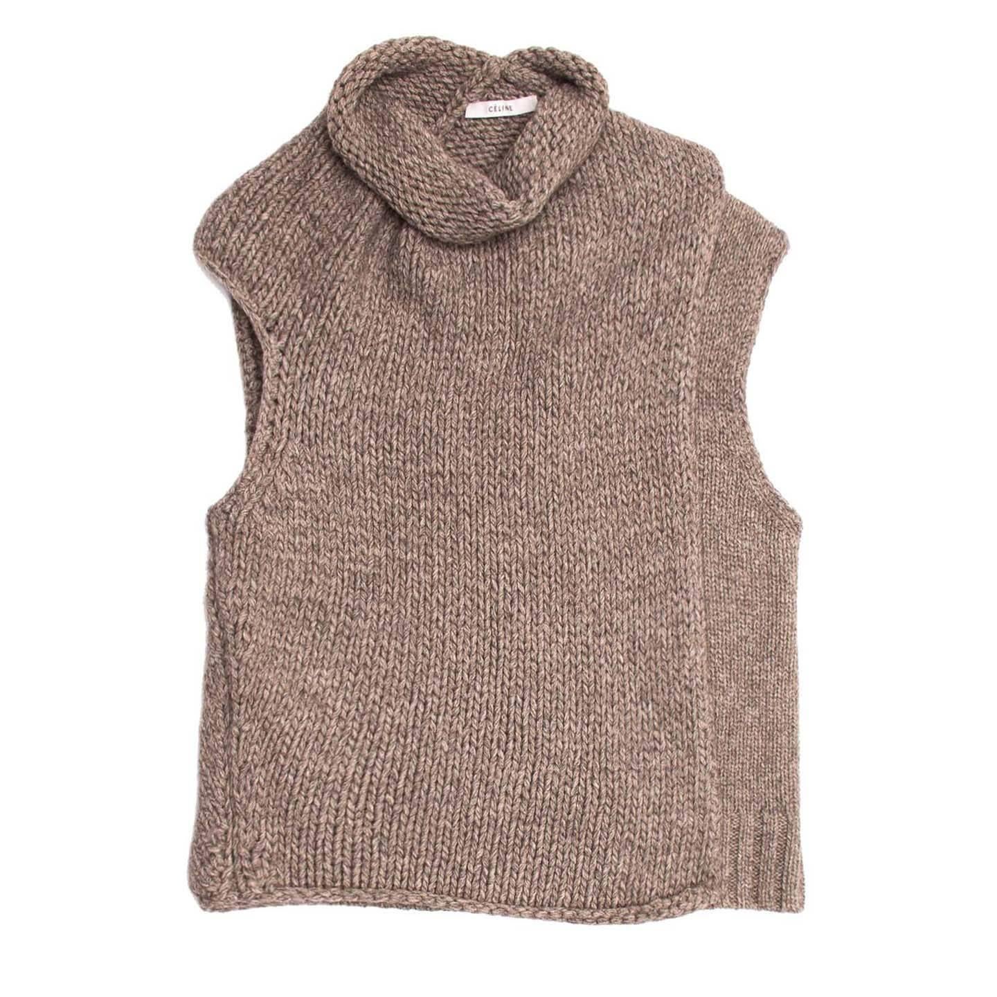 Melange of warm grey and sand sleeveless roll neck chunky knit with wrap overlay at front. Mix of warm wool and yak yarn.

Size  S Universal sizing

Condition  Excellent: never worn with tags