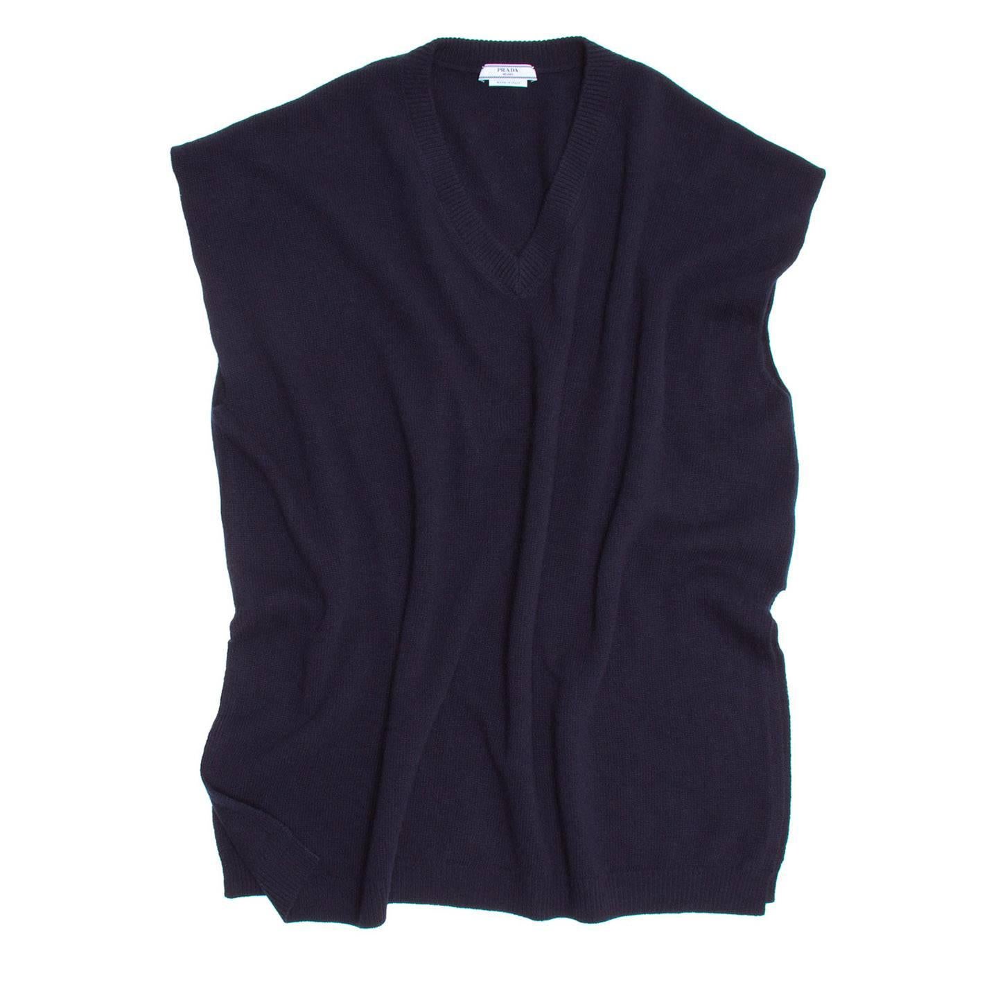 Wool/cashmere navy blue sleeveless V-neck knit top. The fit is long and boxy with dropped shoulders and side opening from hem to waist.

Size  40 Italian sizing

Condition  Excellent: never worn