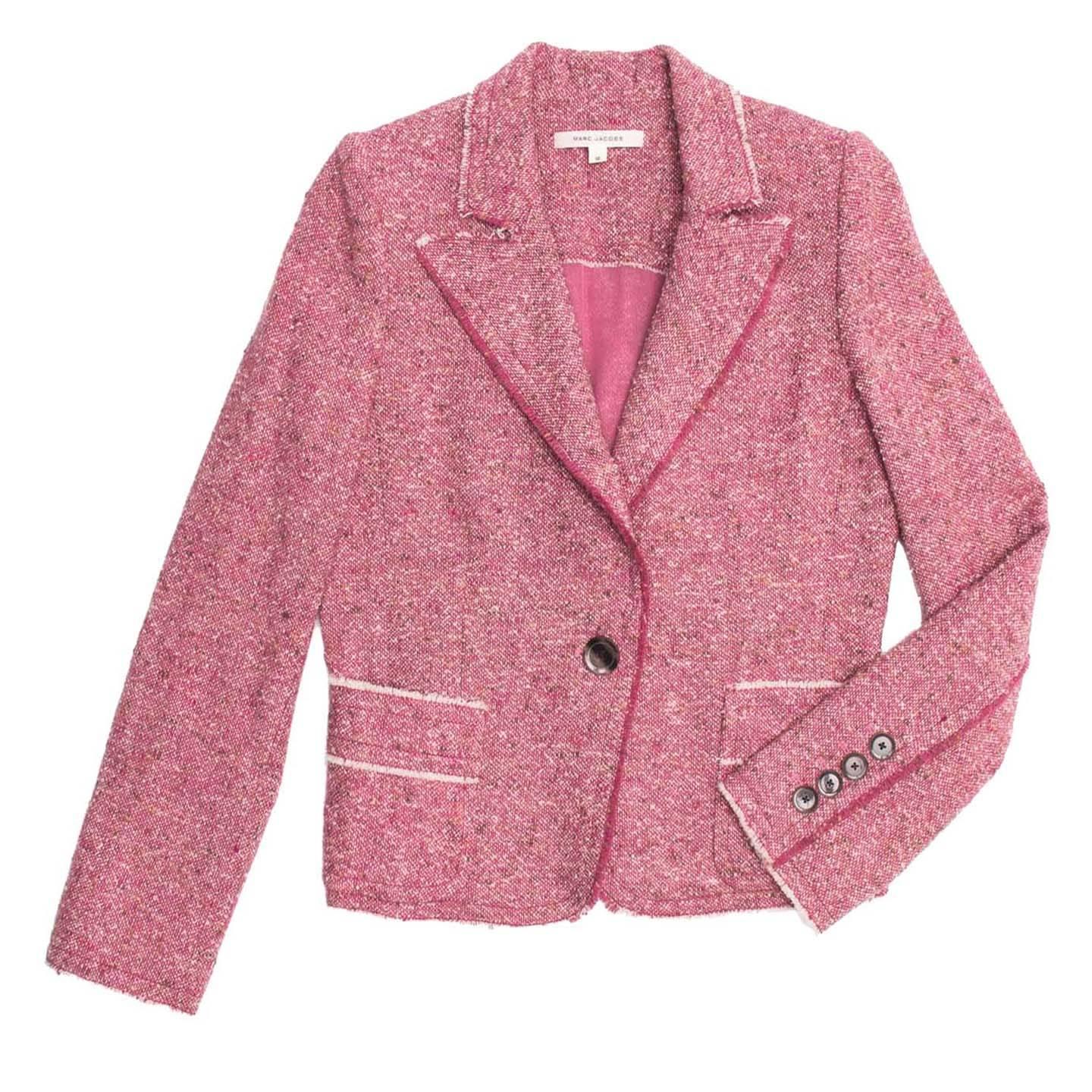 Pink tweed wool single button blazer. The neck profile and most of the seams on body and sleeves are raw edge with short pink or white fringes, as well as on the patch pocket and the back bukle. The style is fitted and the waist line is defined and