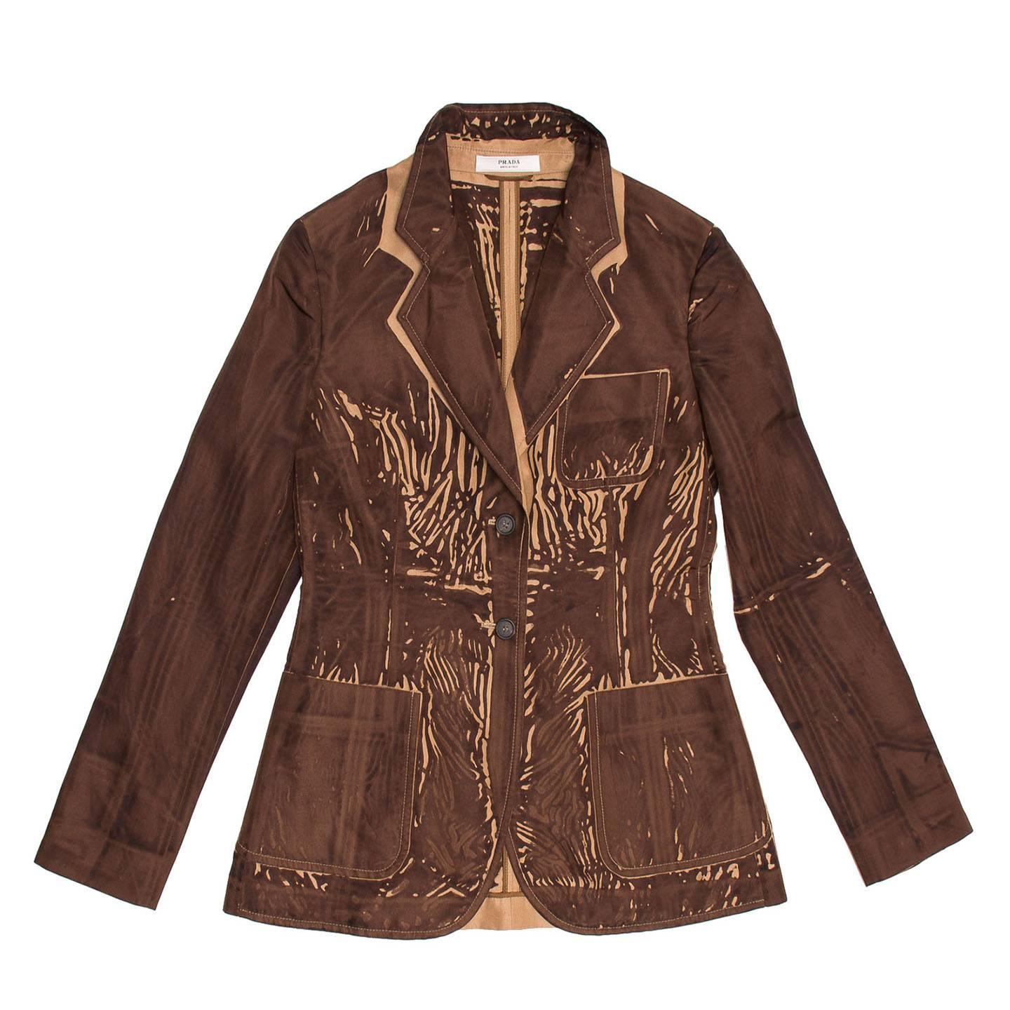 Tan silk blazer with one-of-a-kind dark brown screen print on fabric that leaves tan color parts visible at front, back, under collar, under pockets and inside jacket. The jacket fastens with two buttons and three rounded patch pockets embellish the