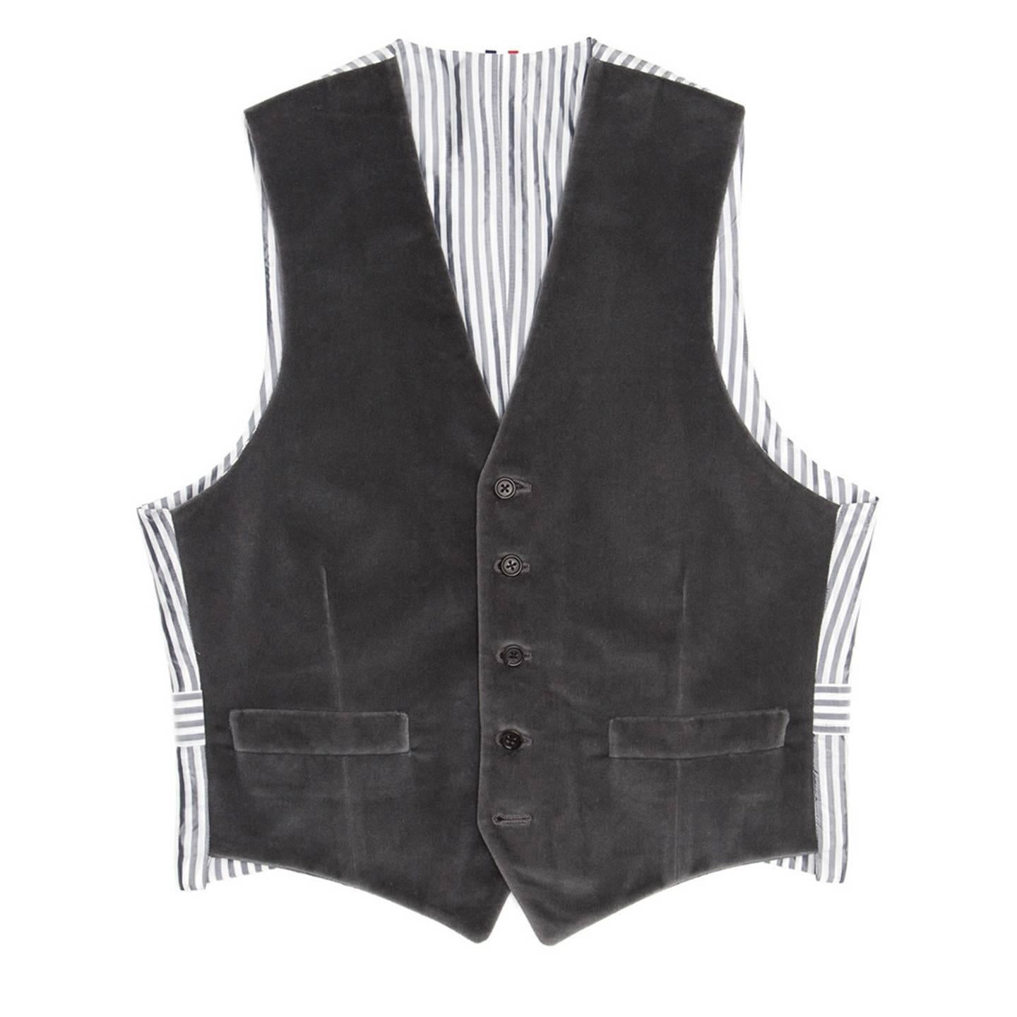Fall 2010 grey velvet vest with grey & white striped back panel and adjustable buttoned back detail. Made for Man Worn by Women.

Size  1

Condition  Excellent: worn once